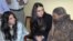 The daughter and wife of the governor of Punjab Province speak to Aasia Bibi (right), who has been sentenced to death for blasphemy 