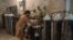 A worker fills oxygen cylinders for hospital use in Peshawar on December 7.