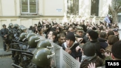 Opposition supporters clash with police during their protest downtown Tbilisi on November 22, 2003.