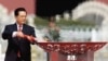 President Hu Jintao lighting the Olympic Torch on Tiananmen Square in Beijing in March