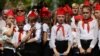 Ukraine - Children in red caps and ties, inspired by the Soviet Pioneers movement, taking part in a meeting of the youth movement "Patriot", an organization of the self-proclaimed People's Republic of Donetsk (DNR) in the outskirts of Donetsk, May 26, 201