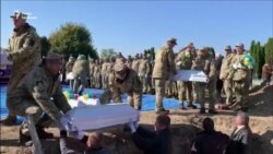 Жертв сталінських репресій перепоховали на Рівненщині Жертв сталінських репресій перепоховали на Рівненщині