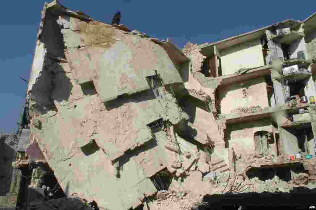 Дом, разрушенный в результате авиаудара. Алеппо, 24 декабря 2013 года   