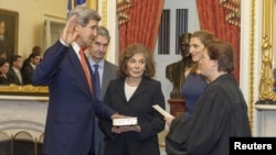 John Kerry (left) is officially sworn in as secretary of state in Washington on February 1.