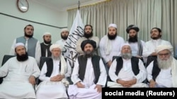 Mullah Abdul Ghani Baradar (center, sitting) will be a key deputy of the head of the new Taliban government.