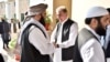 Pakistani Foreign Minister Shah Mehmood Qureshi (center) receives members of the Taliban delegation at the Foreign Office in Islamabad in October 2019. 
