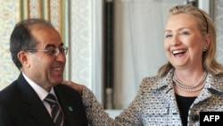 U.S. Secretary of State Hillary Clinton (right) meets with Mahmud Jibril, chairman of the Libyan rebels' National Transitional Council, in Istanbul on July 15.