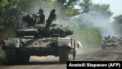 UKRAINE – Ukrainian troop move by tanks on a road of the eastern Ukrainian region of Donbas on June 21, 2022