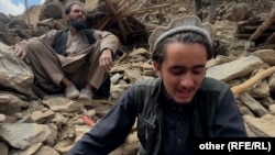 Hamidullah (right) and his neighbors in the district of Chawkai pulled the bodies of his parents, five sisters, and two brothers from the rubble of Afghanistan's deadly earthquake.