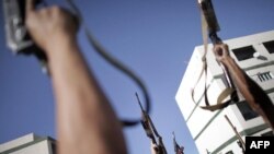 Libyan National Transitional Council (NTC) fighters celebrated in the Abu Salim district of Tripoli on October 14.