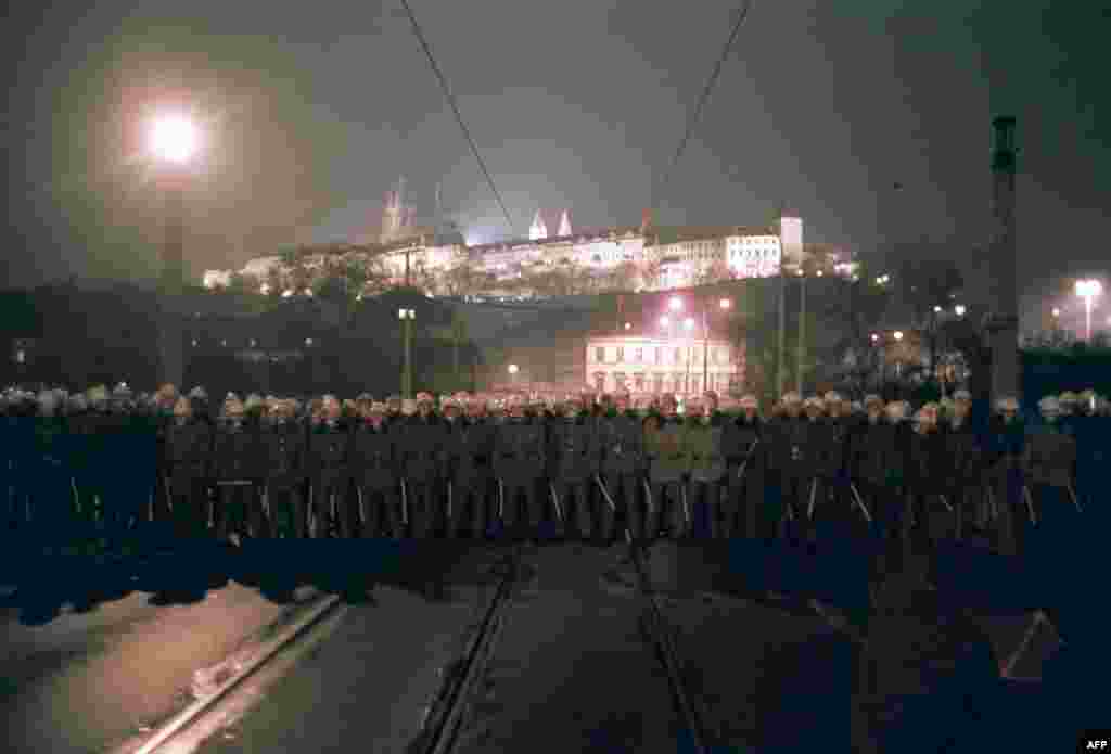 Riot police block a bridge to prevent protesters marching to Prague Castle, the seat of the Czechoslovak president on November 19. The demonstrations were growing rapidly, fueled by shock at authorities' brutal use of force on the first night.