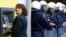 A woman makes a transaction at an ATM during a rally against austerity measures outside the Finance Ministry in Athens late last month.