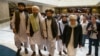 Mullah Abdul Ghani Baradar (third from left), the Taliban's top political leader, arrives with other members of a Taliban delegation for talks in Moscow on May 28, 2019.