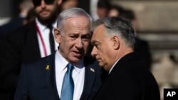 Israeli Prime Minister Benjamin Netanyahu (left) and Hungarian Prime Minister Viktor Orban talk at Buda Castle in Budapest on April 3.