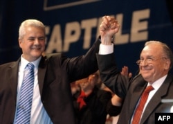 Adrian Năstase și Ion Iliescu.