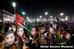 Supporters of the Pakistan Peoples Party (PPP) hold up masks depicting their leader Bilawal Bhutto Zardari during an anti-government protest rally organized by the Pakistan Democratic Movement on Ocotber 18.
