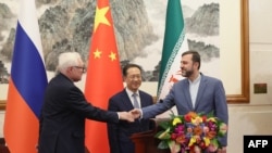 Замминистра иностранных дел России Сергей Рябков и его коллеги Ма Чжаосю (Китай) и Казем Гарибабади (Иран) на переговорах в Пекине в марте этого года