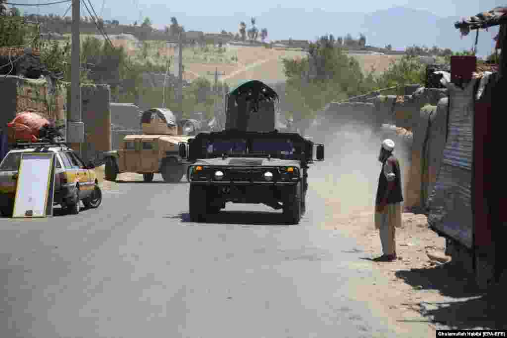 Afghan security forces patrol the Alishang district of Laghman Province after reportedly clearing the area of Taliban fighters on July 8. 