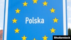 Belarus - Road sign indicating the border of a European Union country: Poland, Shutterstock Photo, undated