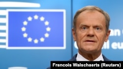 Дональд Туск выступает на пресс-конференции в Брюсселе, 29 июня 2018 года