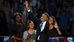 U.S. -- President Barack Obama walks on stage with first lady Michelle Obama and daughters Sasha and Malia to deliver his victory speech on election night in Chicago, 07Nov2012