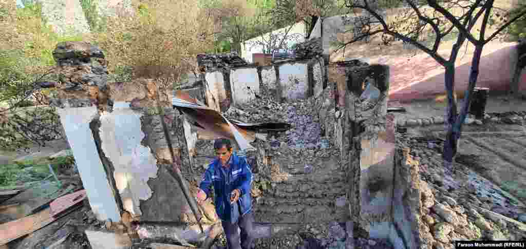 A man among the ruins of a building in Somoniyon, Tajikistan.