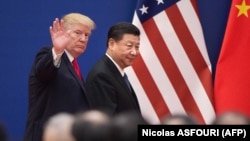 US President Donald Trump (left) and his Chinese counterpart, Xi Jinping (file photo)