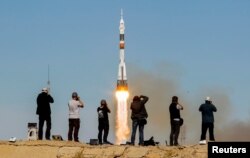 A Soyuz MS-10 spacecraft blasts off to the ISS from the Baikonur Cosmodrome in October 2018.