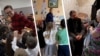 Moldova: Vladimir Cebotari, primary school teacher; Gheorghe Slubschi, kindergarten educator; and priest Oleg Lișciuc, who has also taken on the role of social worker.