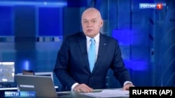 RUSSIA -- Dimtry Kiselyov, one of Russia's most powerful media figures, speaks during his Sunday news program on state-owned TV channel Rossia-1.