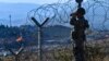 A Macedonian soldier patrols the border with Greece, near Gevgelija.