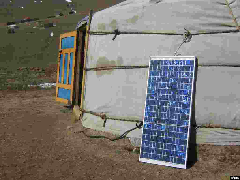 A solar panel rests outside a felt ger, or yurt, outside the Mongolian capital, Ulan Bator. - Something old, something new. Mongolian nomads have lived for centuries in gers, the felt tents that are easy to dismantle and transport when it's time for a family to move its herds to a new pasture. But modern times are creeping into the old way of life -- many gers have solar panels as a cheap and easy way to generate power for radios, mobile phones, and even televisions.