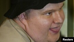 Internet millionaire Kim Dotcom pictured during his trial for insider trading and embezzlement in 2002