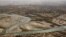 An aerial view shows the Helmand River in Afghanistan's Helmand Province. According to a 1973 agreement, Afghanistan is obligated to provide Iran with 850 million cubic meters of water annually from the Helmand River. 