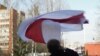 Belarus - Syarhey Kavalenka raised the flag near the court's building, 20apr2010