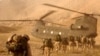 U.S. troops approach a Chinook helicopter near Kandahar. (file photo).