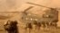 U.S. troops approach a Chinook helicopter near Kandahar. (file photo).