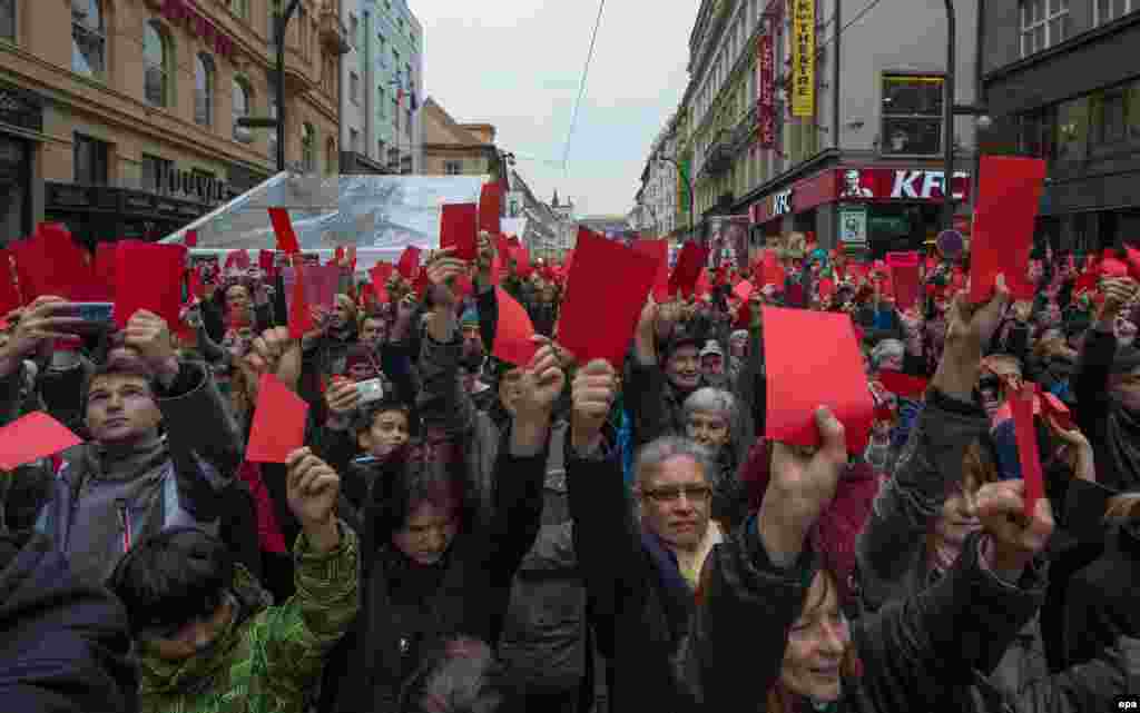 Czech Republic -- Protesters show symbolical red cards during a prostest against Czech President Milos Zeman in Prague, Czech Republic 17 November 2014.