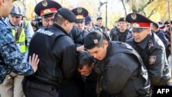 Kazakh police detain anti-government protesters in Almaty in October.