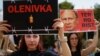 Relatives of defenders of the Azovstal steelworks in Mariupol hold a rally in Kyiv on July 30 demanding that Russia be designated as a terrorist state following the deaths of Ukrainian POWs in a deadly attack on a prison in Olenivka.