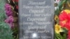 Спільна могила росіян, які загинули під час збройного протистояння на Донбасі у 2014 році. Фото з бази даних загиблих на Донбасі, зібраної українською організацією «Мирний берег»