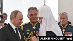 Зліва направо: російський президент Володимир Путін, міністр оборони Росії Сергій Шойгу і Московський патріарх Кирило (архівне фото)