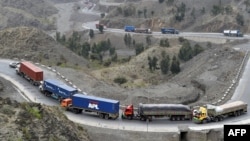 Cargo trucks drive through the mountainous area near Torkham by Afghanistan's border with Pakistan. (file photo)