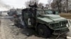 Знищені бронеавтомобілі високої прохідності російської армії «Тигр-М» на дорозі в Харкові, 28 лютого 2022 року