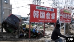 Последствия землетрясения в в Тагажо, префектура Мияги, 13 марта 2011