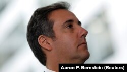 Michael Cohen, President Donald Trump's personal attorney, looks on as his attorney (not pictured) delivers a statement to reporters after meeting with Senate Intelligence Committee staff on Capitol Hill in Washington, U.S., September 19, 2017