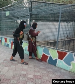 Young Taliban fighters with their weapons at Kabul Zoo, as photographed surreptitiously by the former Radio Azadi journalist.