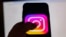 This picture taken in Istanbul on August 2, 2024, shows the logo of the social network Instagram on a smartphone.
