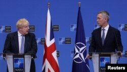 British Prime Minister Boris Johnson and NATO Secretary-General Jens Stoltenberg hold a joint news conference in Brussels on February 10.