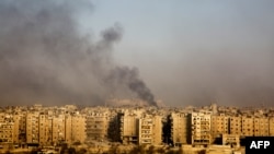 Дим над підконтрольною повстанцям частиною Алеппо, Сирія, 12 грудня 2016 року